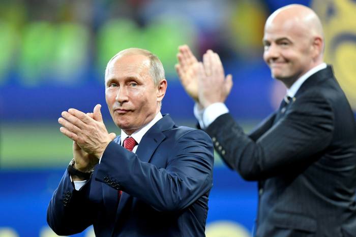 Russian president Vladimir Putin with Fifa president Gianni Infantino at the 2018 World Cup n Moscow. Fifa has banned Russia from all international football competitions