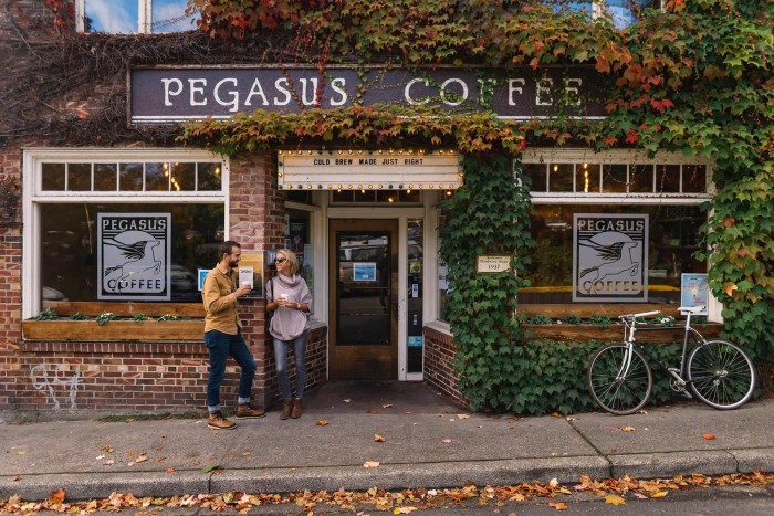 Customers stand outside Pegasus Coffee House in Bainbridge Island, Washington
