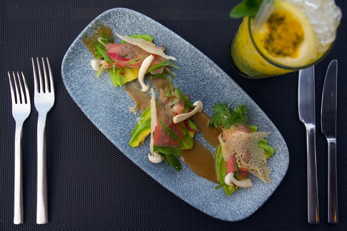 A tuna sashimi salad at Skybar 25, served with a passionfruit Mojito