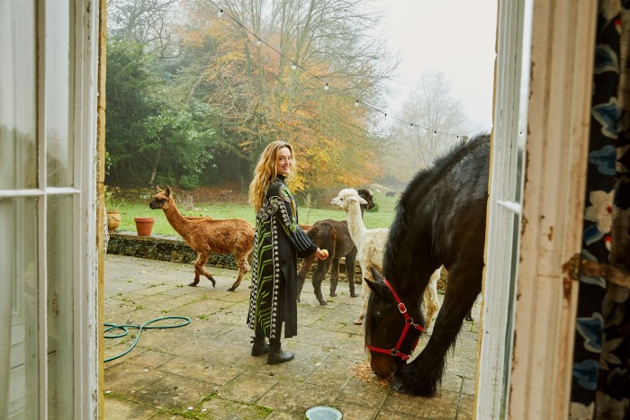 Temperley, wearing her own Farrah kimono, with her animals