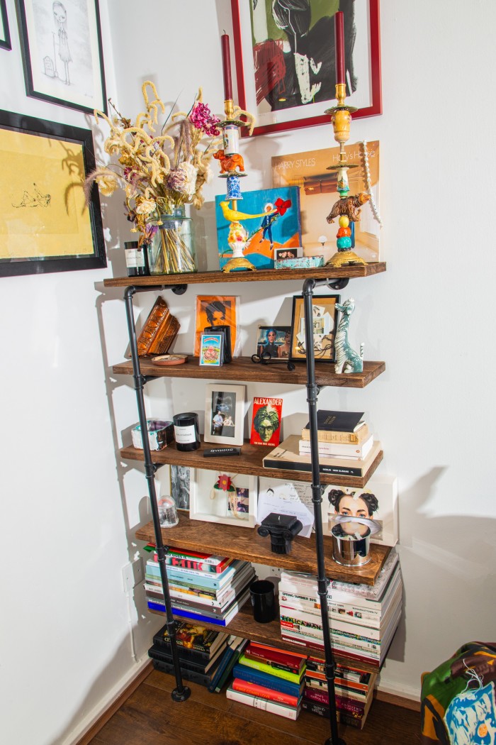 A bookshelf in Lambert’s living room