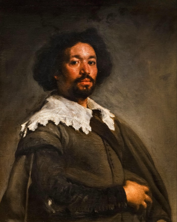A man wearing black and white renaissance clothing is portrayed against a dark, blurred background