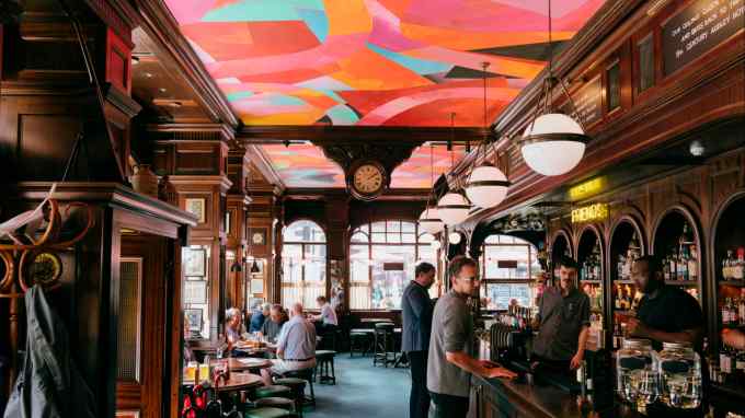 The Audley Public House in Mayfair, London: a Victorian-style pub with an orange, pink and blue ceiling painted by the late Phyllida Barlow