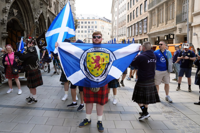 Scotland fans with national and team flags in Munich