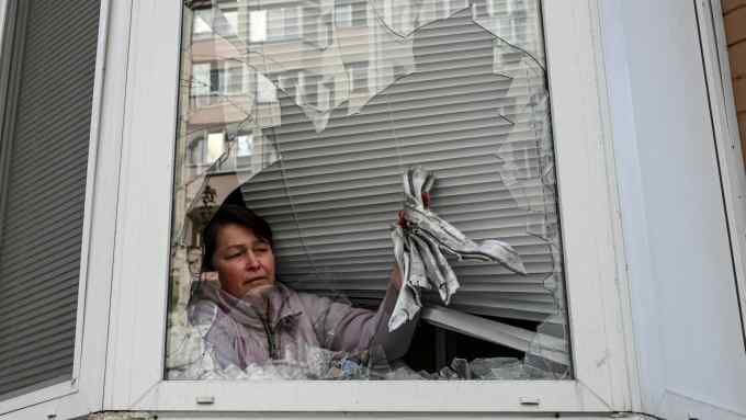 A local resident shows debris from a Russian missile that landed in her apartment after it was shot down, amid Russia’s attack on Ukraine, in the town of Ukrainka, Kyiv region