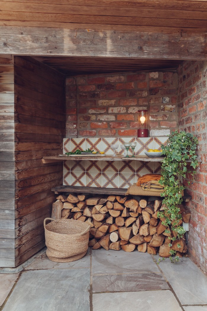 Wood stacked by the outdoor dining area