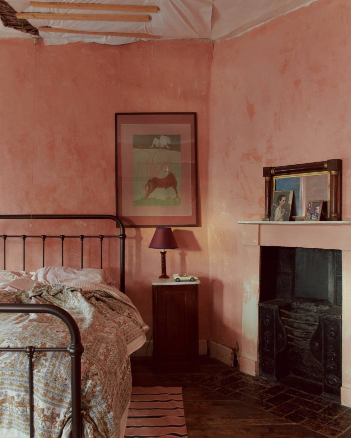 The limewashed walls of Wilson’s bedroom – battens support the plasterwork where the family’s cat fell through the ceiling