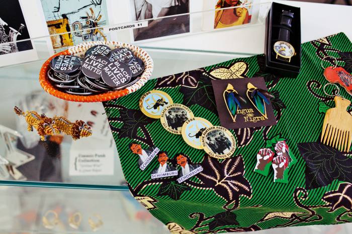 Lapel pins, $10-$15, Lingua Nigra earrings, $124, and Cyril Innis watch, $40