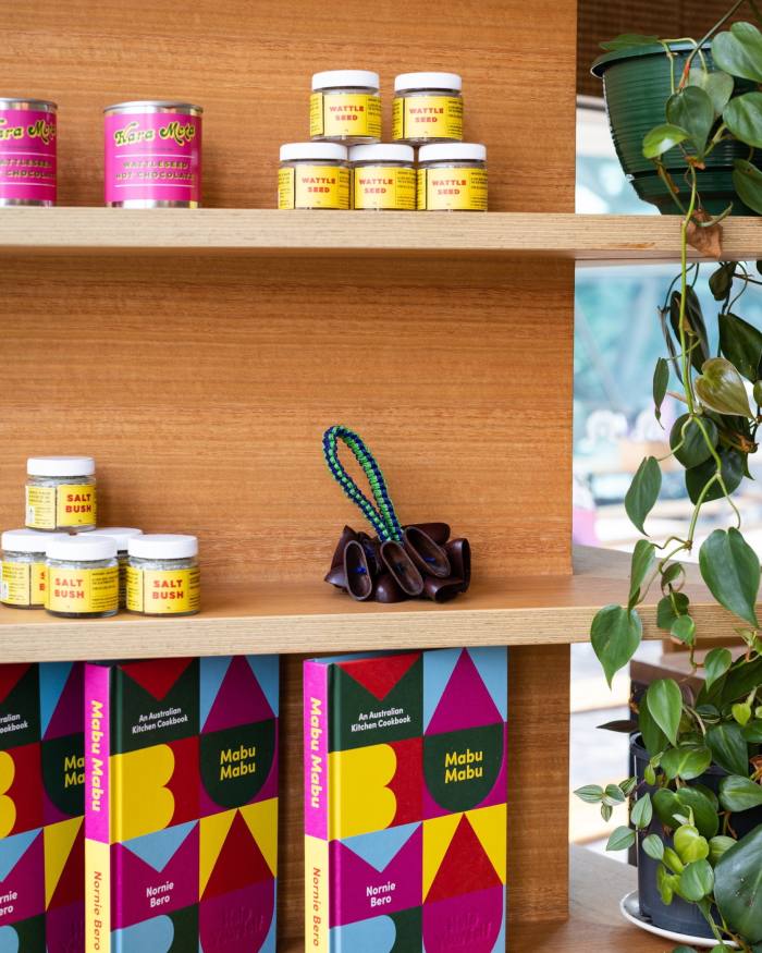 Mabu Mabu products and Bero’s cookbook on wooden shelves