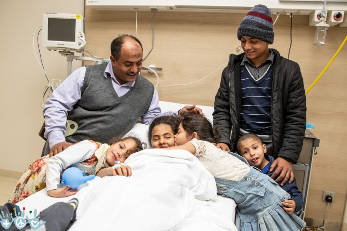 A refugee family from Yemen whose eldest daughter has just had surgery provided through COWF