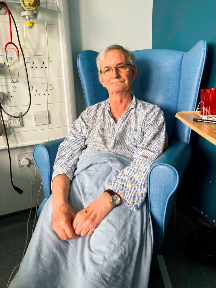 a hospital patient sitting on a chair