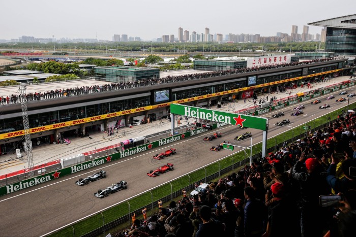 A stadium view of the Shanghai Grand Prix in 2019 with the Shanghai skyline in the distance