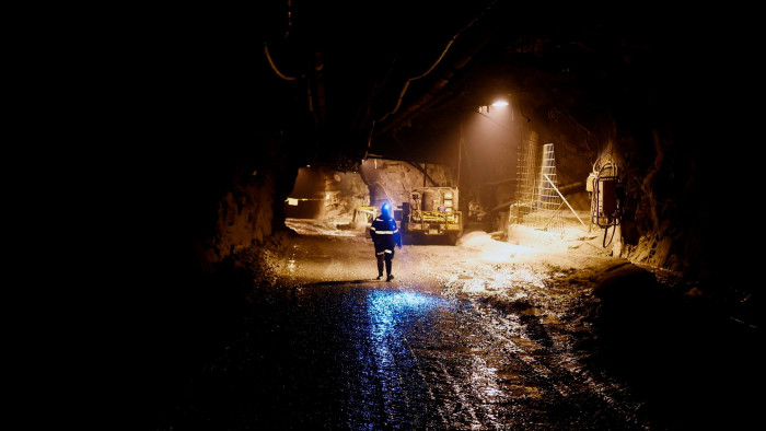 A worker walks in an underground mine, part of the Grasberg copper and gold mine in Papua 
