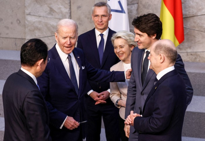 (L-R) Japan’s Prime Minister Fumio Kishida, U.S. President Joe Biden, NATO Secretary General Jens Stoltenberg, European Commission President Ursula von der Leyen and Canada’s Prime Minister Justin Trudeau and Germany’s Chancellor Olaf Scholz before G7 leaders’ family photo during a NATO summit on Russia’s invasion of Ukraine, at the alliance’s headquarters in Brussels, on March 24, 2022 in Brussels, Belgium