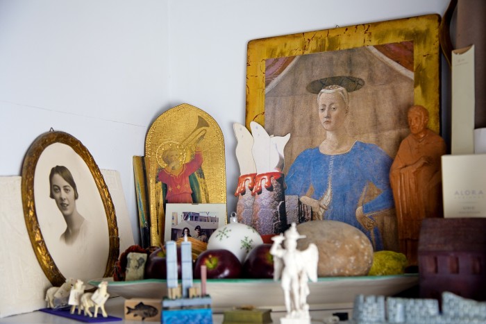 Ornaments with a poster of a painting by Piero della Francesca and a photograph of Pesce’s mother