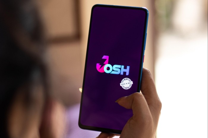 A logo that reads Josh on a smartphone screen