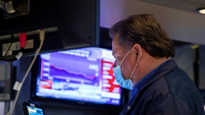A trader at the New York Stock Exchange