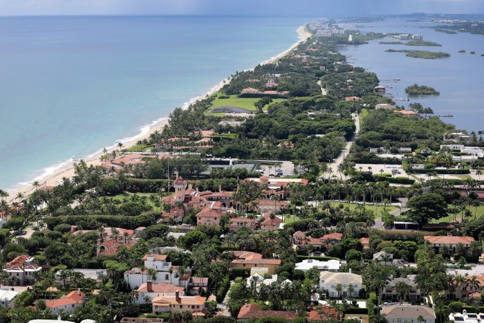 Coastlines border large residential properties in an aerial view of Palm Beach in Florida