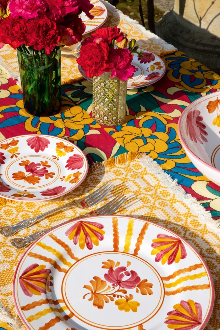 The Artigiana collection’s Blossom plates, £66 and £73, and salad bowl, £120, Lecce placemat, £34.50, and Dahlia tablecloth, £280