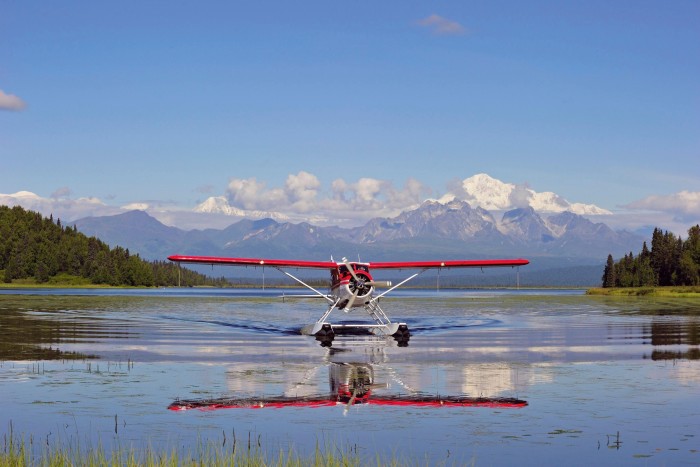 A De Havilland Beaver lands on a lake in Alaska