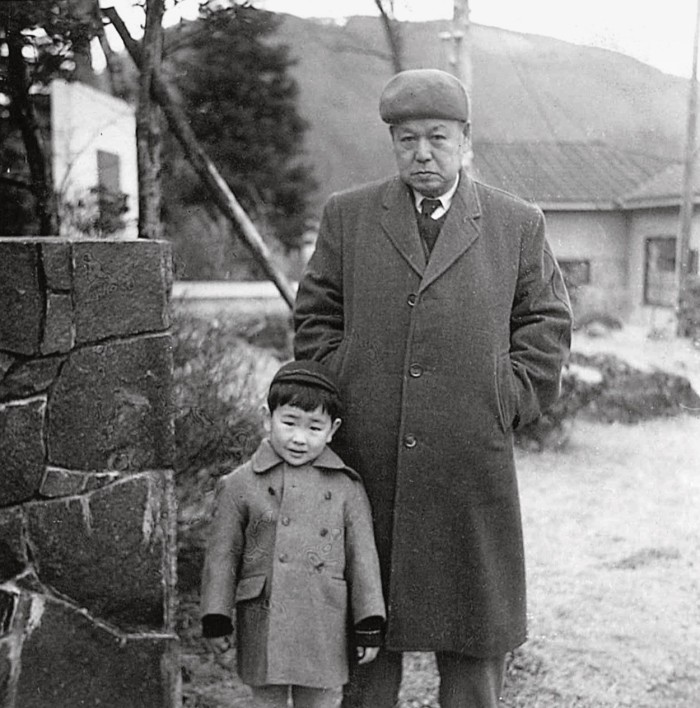 Kuma as a young boy with his grandfather