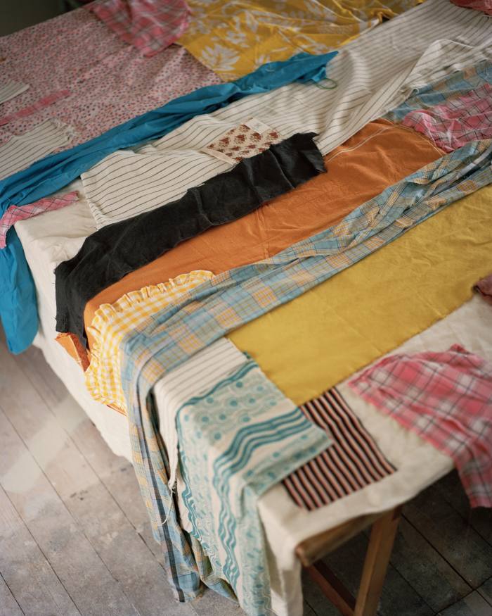 Fabric laid out as the beginning of a new patchwork piece by Kings