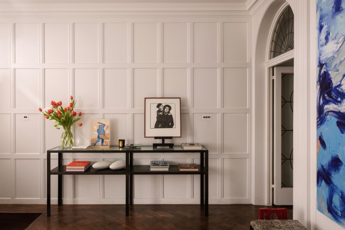 The entrance hall: on the wall hangs a painting by Donna Huanca. On the Peter Marino console table sits an artwork by Alekos Fassianos and, on the easel, a David Bailey photo portrait of Nureyev and Cecil Beaton