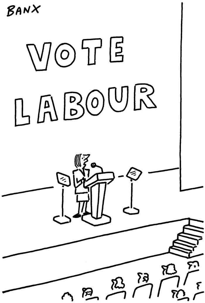 Banx cartoon of Liz Truss making a speech at a Tory party conference. Behind her in large letters is the slogan: VOTE LABOUR
