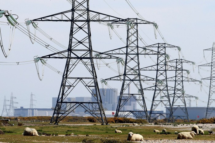 Pylons carry electricity away from Dungeness nuclear power station in Kent