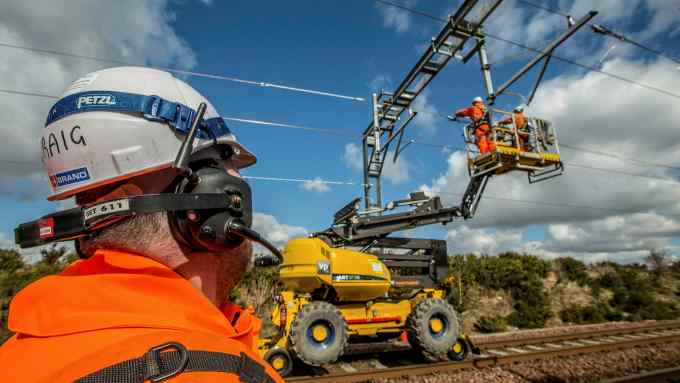 Way to go: railway workers working on overhead lines