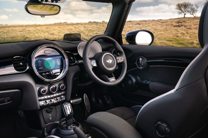 The round, centrally-placed speedometer that was a signature of the original Mini now takes the form of an infotainment system