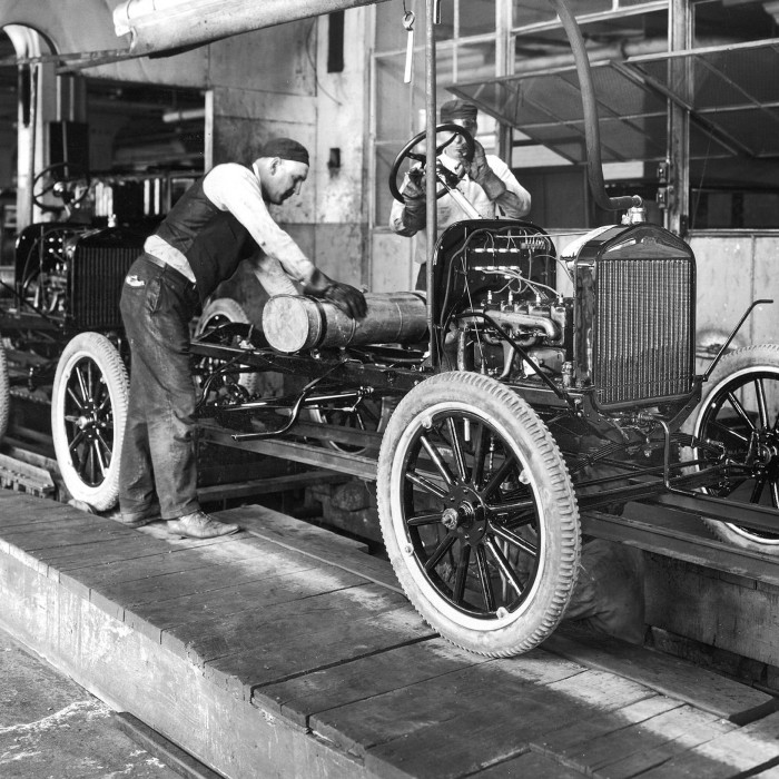 Ford’s Model T car assembly line at the Highland Park plant, Michigan, 1913. The production process revolutionised the auto industry