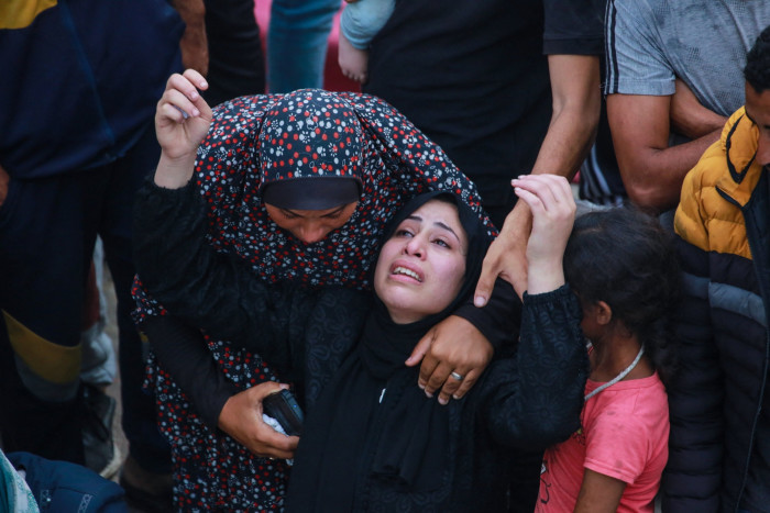 Relatives mourn a man killed in the Israeli airstrike on Nuseirat