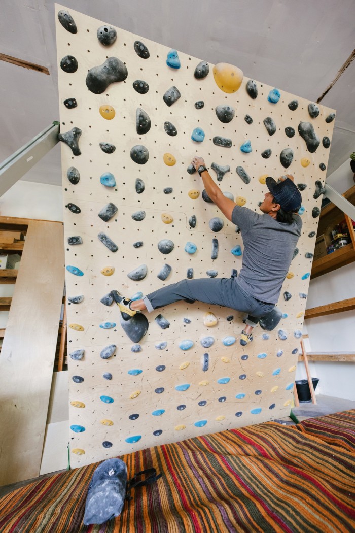 Jimmy Chin on his bouldering wall in his garage