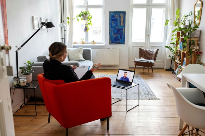 Psychotherapist providing support to patient distantly by video call. Woman psychologist conducting an online therapy session with her patient on laptop