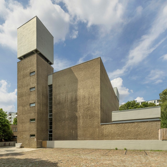 A church exterior which looks like it’s made out of large concrete blocks