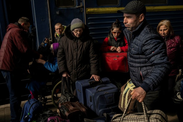 People escaping from Mariupol arrive at Lviv, western Ukraine, along with passengers from Zaporizhzhia