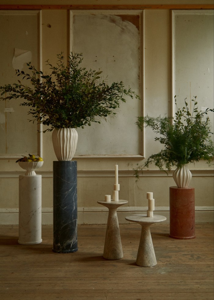 From left: Ransom & Dunn white marble Neo Plinth, £2,395, and Cloak pedestal bowl, £565. Black marble Neo Plinth, £2,595, and Cloak large vase, £625. Juno tall side table, £985, Juno medium side table, £925, and Luna Onyx candlestick holders, £395 for set of three. Marron Imperial marble Neo Plinth, £2,100, and Cloak small vase, £545
