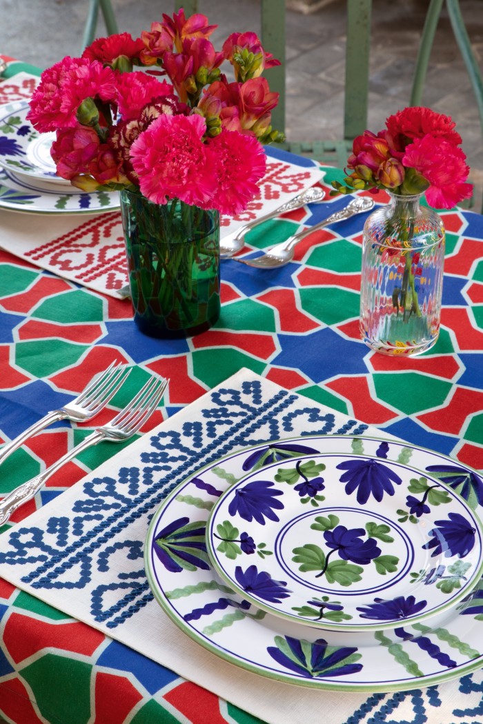 The Artigiana collection’s Blossom plates, £66 and £73, Goya placemat, £55, Tiles tablecloth, £280, and Murano oil bottle, £215