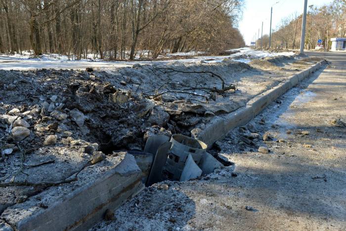 A rocket body stuck into a road after recent shelling on the northern outskirts of Kharkiv on February 24, 2022