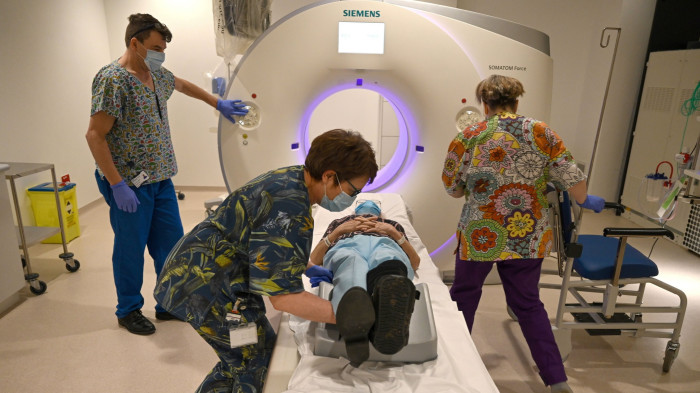 NHS England patient on a CT scanner