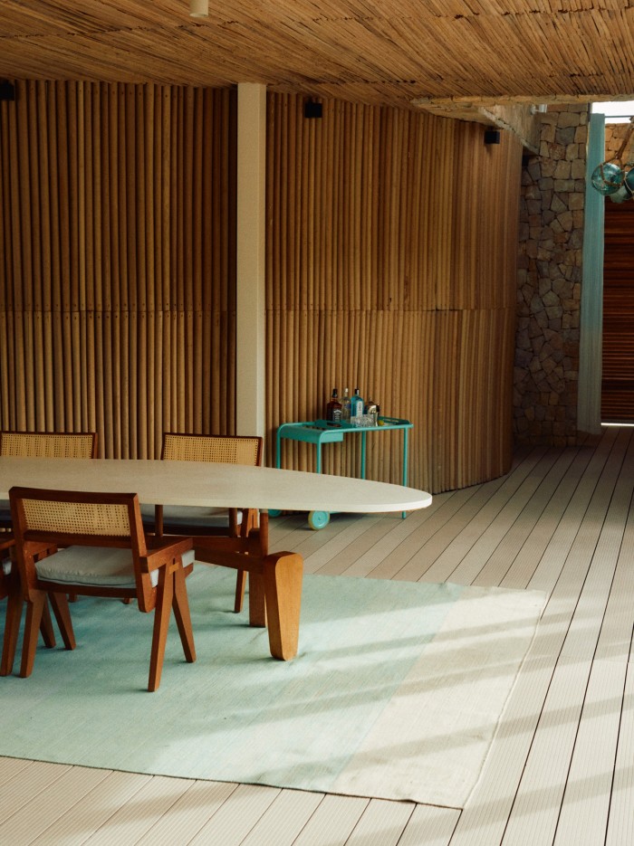 Indoor dining table in one of the beachfront villas; the use of local materials is on display