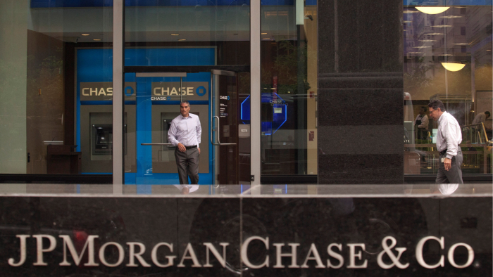 A customer exits the lobby of JPMorgan headquarters in New York