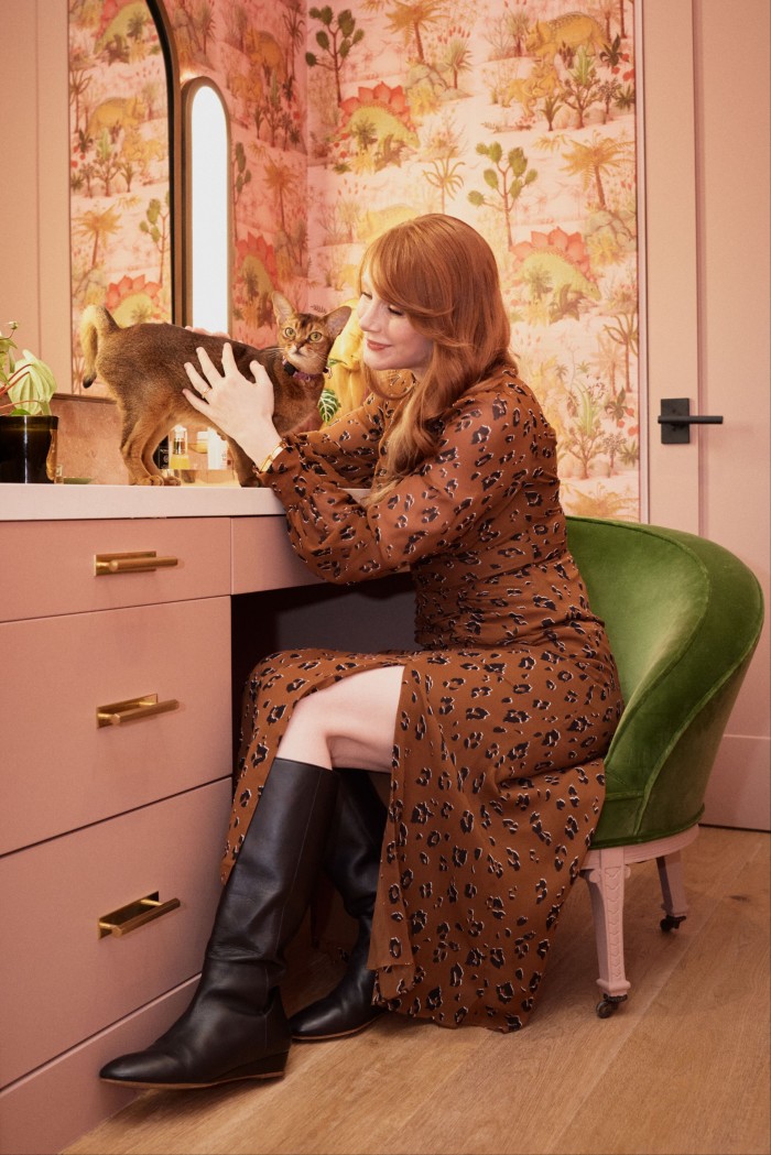 Howard at her dressing table with Lily the cat