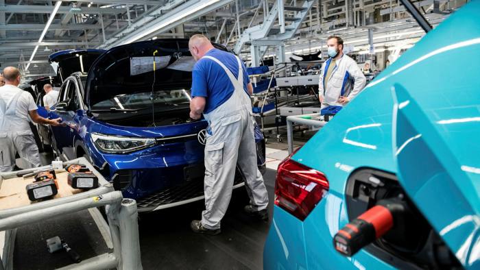 Workers assemble the new Volkswagen ID.4 electric sport utility vehicle at the VW factory in Zwickau, Germany