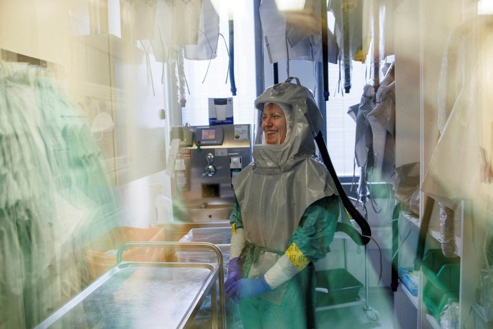 A biologist at the French-Austrian biotech firm Valneva enters a laboratory to work on an inactivated whole-virus vaccine against coronavirus in Vienna, Austria, last December