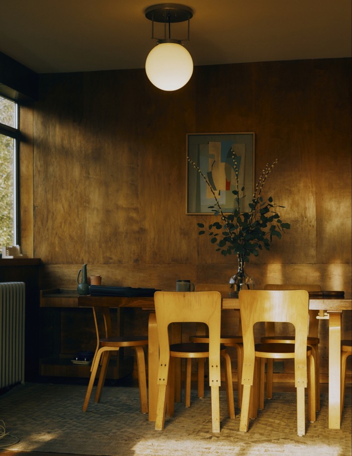 His table and chairs by Alvar Aalto, Gerald Summers tea trolley and artwork by Ben Nicholson