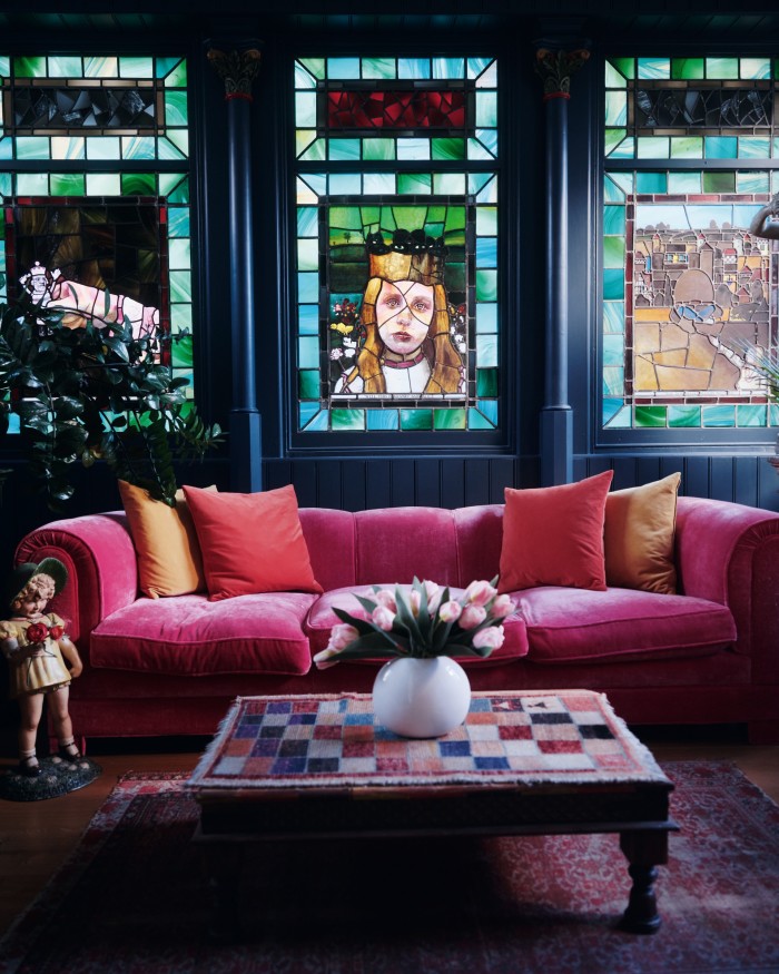 Stained-glass windows depicting Alice in Wonderland in his Alice Room