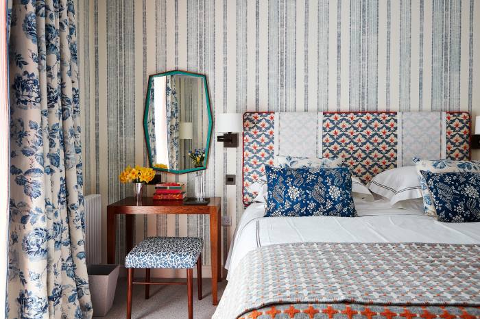 Wallpaper, curtain and headboard fabric by Richard Smith of Madeaux in Hastings. Bed cushions by Katherine Pole at the Decorative Antique Fair