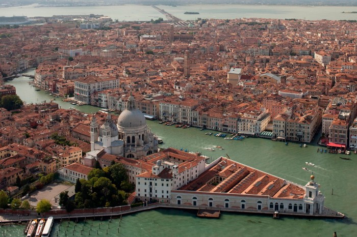 An aerial shot of a triangular building in Venice, the former customs house